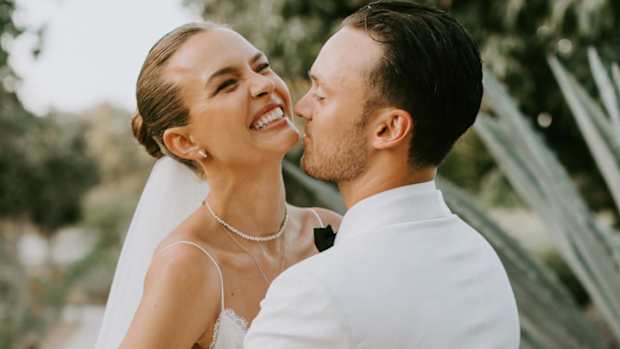 Credit_Courtney Pecorino - The bride and groom embrace after the ceremony at Acre Baja